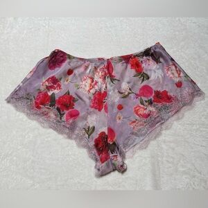 Victoria’s Secret Size Small floral sleep shorts.  Elastic waist, lace at leg
